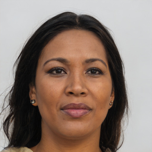 Joyful asian adult female with long  brown hair and brown eyes