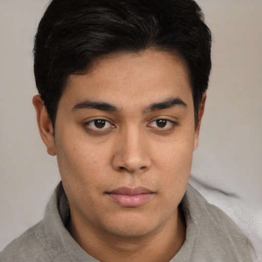 Neutral latino young-adult male with short  brown hair and brown eyes