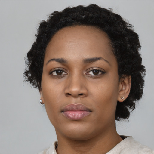 Neutral black young-adult female with short  black hair and brown eyes