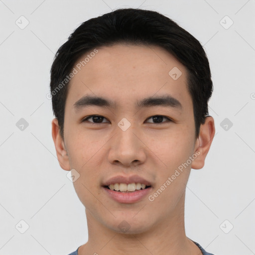 Joyful asian young-adult male with short  black hair and brown eyes