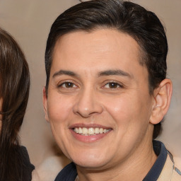 Joyful white adult female with medium  brown hair and brown eyes