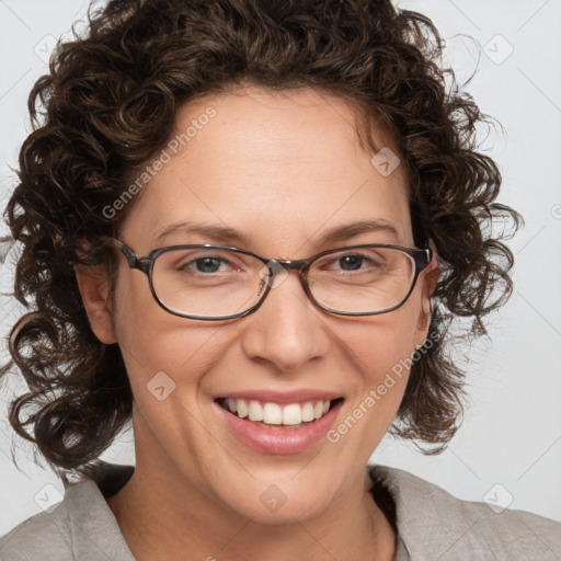 Joyful white adult female with medium  brown hair and blue eyes