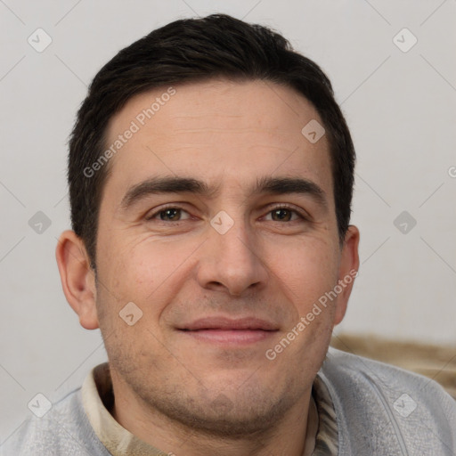 Joyful white adult male with short  brown hair and brown eyes