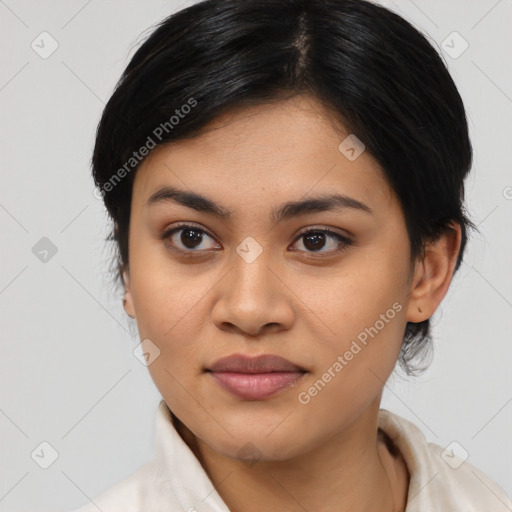 Joyful asian young-adult female with medium  black hair and brown eyes