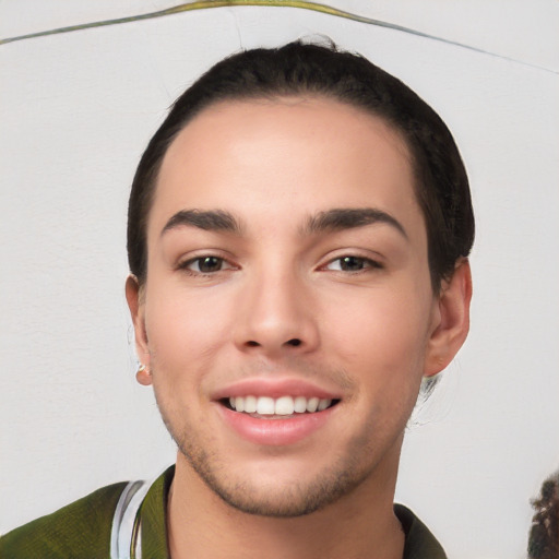 Joyful white young-adult male with short  black hair and brown eyes