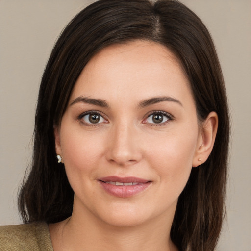 Joyful white young-adult female with medium  brown hair and brown eyes