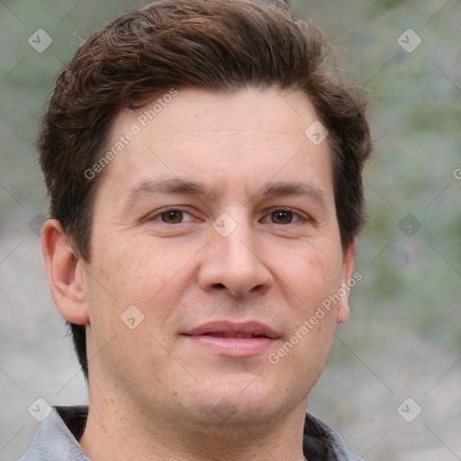 Joyful white adult male with short  brown hair and grey eyes