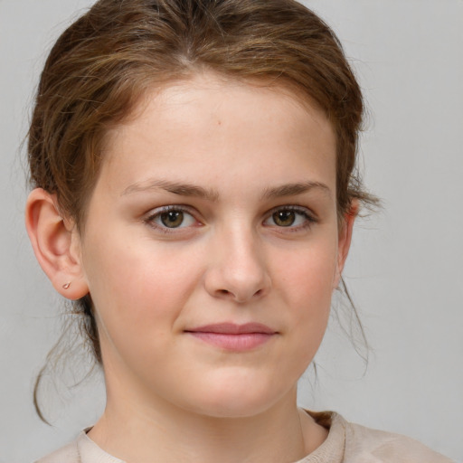 Joyful white child female with medium  brown hair and brown eyes