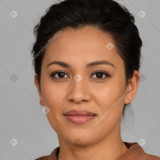 Joyful latino young-adult female with short  brown hair and brown eyes