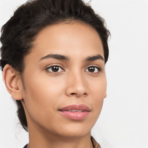 Joyful latino young-adult female with short  brown hair and brown eyes