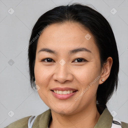 Joyful asian young-adult female with medium  brown hair and brown eyes