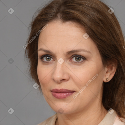 Joyful white adult female with medium  brown hair and brown eyes