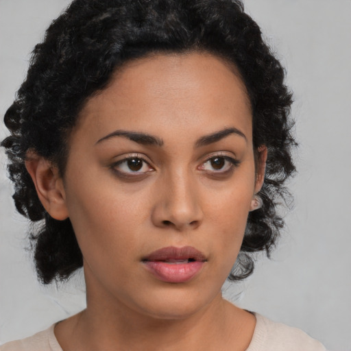 Neutral latino young-adult female with medium  brown hair and brown eyes