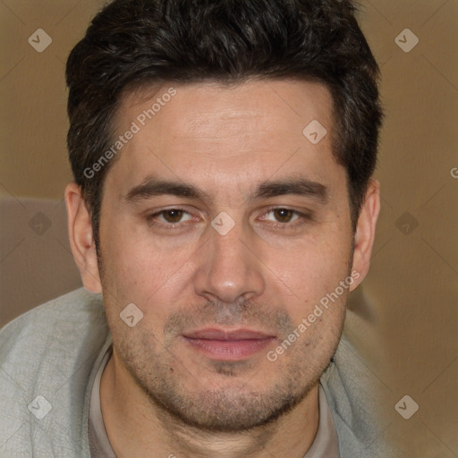 Joyful white adult male with short  brown hair and brown eyes