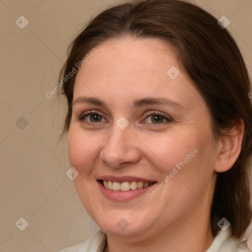 Joyful white adult female with medium  brown hair and grey eyes