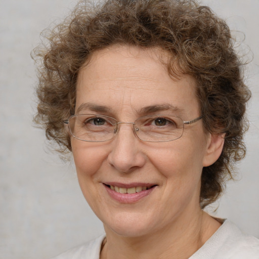 Joyful white middle-aged female with medium  brown hair and brown eyes