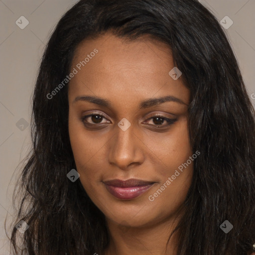 Joyful black young-adult female with long  brown hair and brown eyes