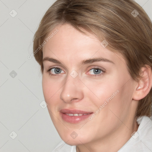 Joyful white young-adult female with medium  brown hair and blue eyes