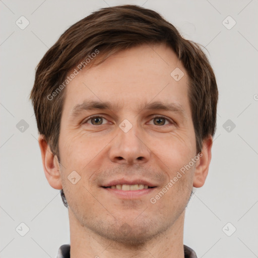 Joyful white adult male with short  brown hair and grey eyes