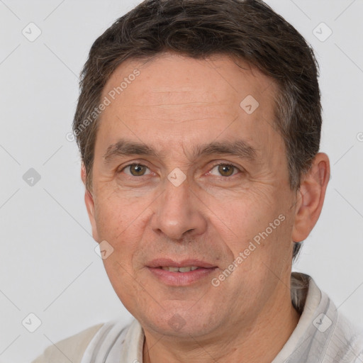 Joyful white adult male with short  brown hair and brown eyes