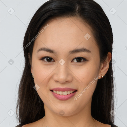 Joyful asian young-adult female with long  brown hair and brown eyes