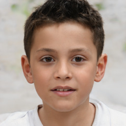 Joyful white child male with short  brown hair and brown eyes