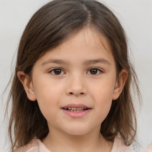 Joyful white child female with medium  brown hair and brown eyes