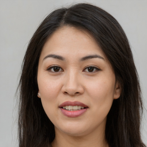 Joyful white young-adult female with long  brown hair and brown eyes