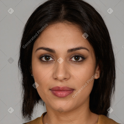 Joyful latino young-adult female with medium  brown hair and brown eyes