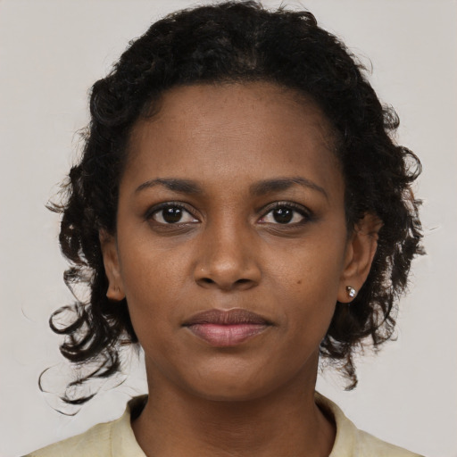 Neutral black young-adult female with short  brown hair and brown eyes