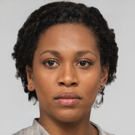Neutral black young-adult female with short  black hair and brown eyes