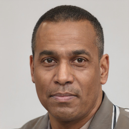 Neutral latino adult male with short  black hair and brown eyes
