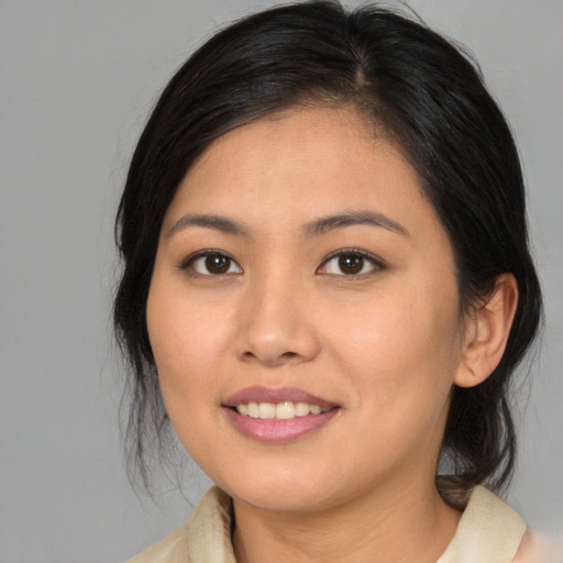 Joyful asian young-adult female with medium  brown hair and brown eyes
