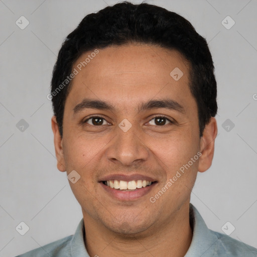 Joyful white young-adult male with short  black hair and brown eyes