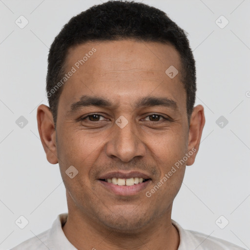 Joyful white adult male with short  black hair and brown eyes