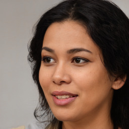 Joyful asian young-adult female with long  brown hair and brown eyes