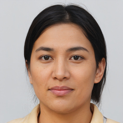 Joyful asian young-adult female with medium  brown hair and brown eyes