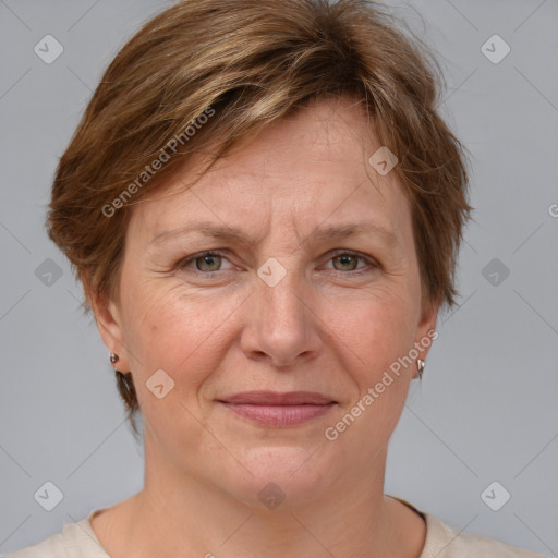 Joyful white adult female with medium  brown hair and grey eyes