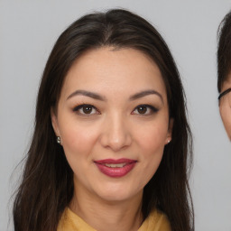 Joyful white young-adult female with medium  brown hair and brown eyes