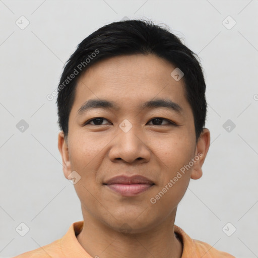 Joyful asian young-adult male with short  black hair and brown eyes