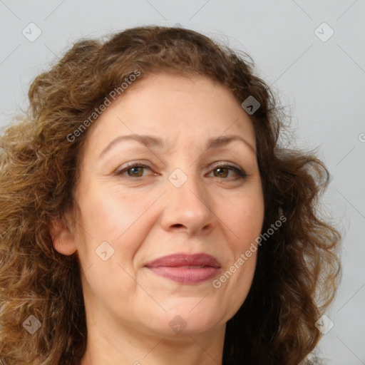 Joyful white adult female with long  brown hair and brown eyes