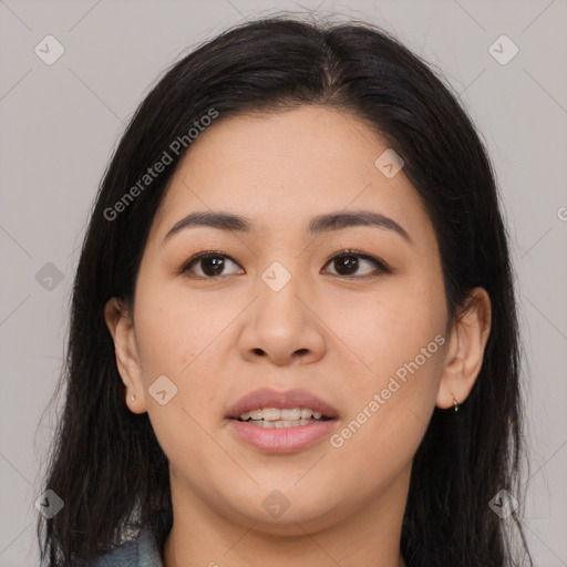 Joyful latino young-adult female with long  black hair and brown eyes