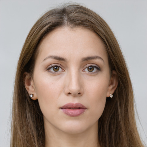 Joyful white young-adult female with long  brown hair and grey eyes