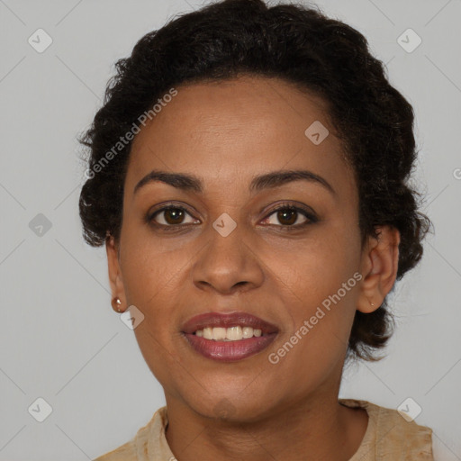 Joyful black adult female with short  brown hair and brown eyes