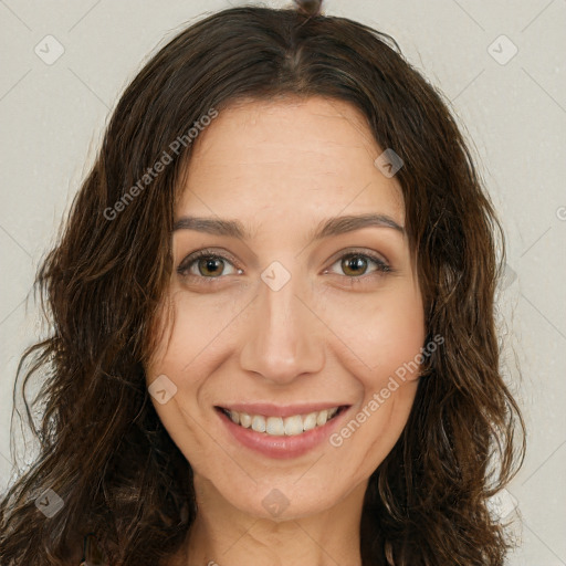 Joyful white young-adult female with long  brown hair and green eyes