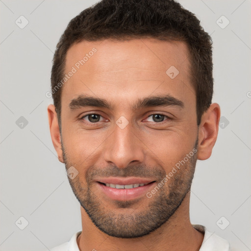 Joyful white young-adult male with short  brown hair and brown eyes