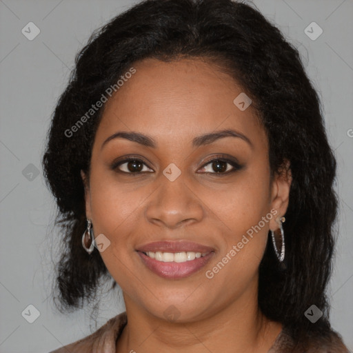 Joyful black young-adult female with long  brown hair and brown eyes