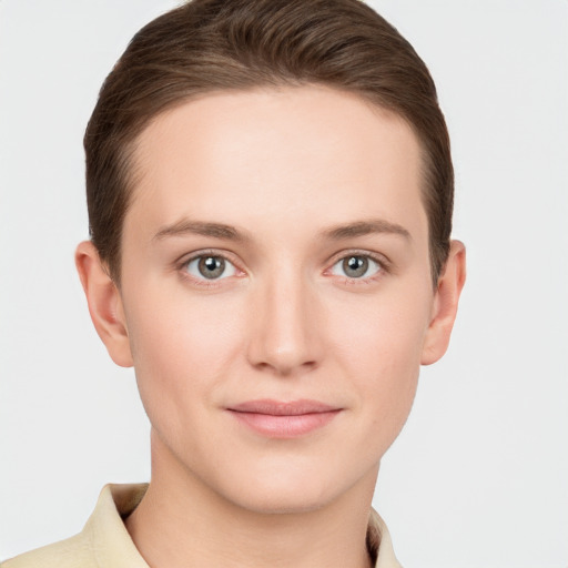 Joyful white young-adult female with short  brown hair and grey eyes