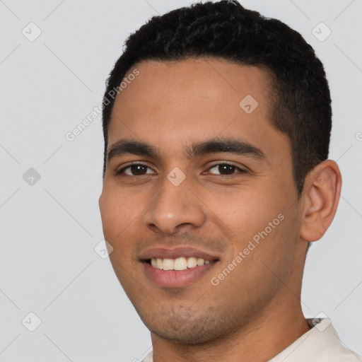 Joyful latino young-adult male with short  black hair and brown eyes