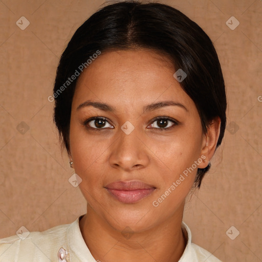 Joyful latino young-adult female with medium  brown hair and brown eyes